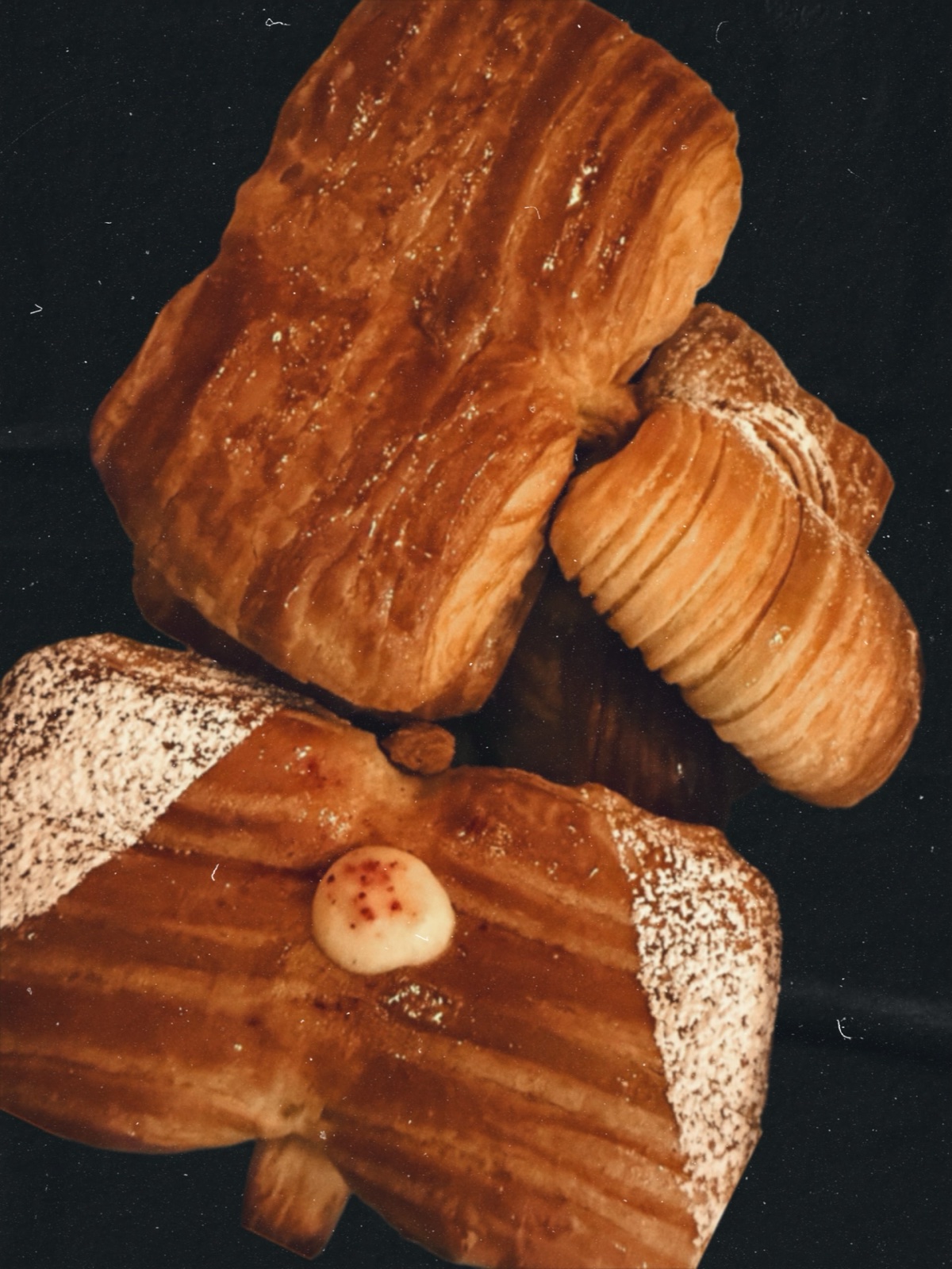 A selection of viennoiserie including a bow tie pastry