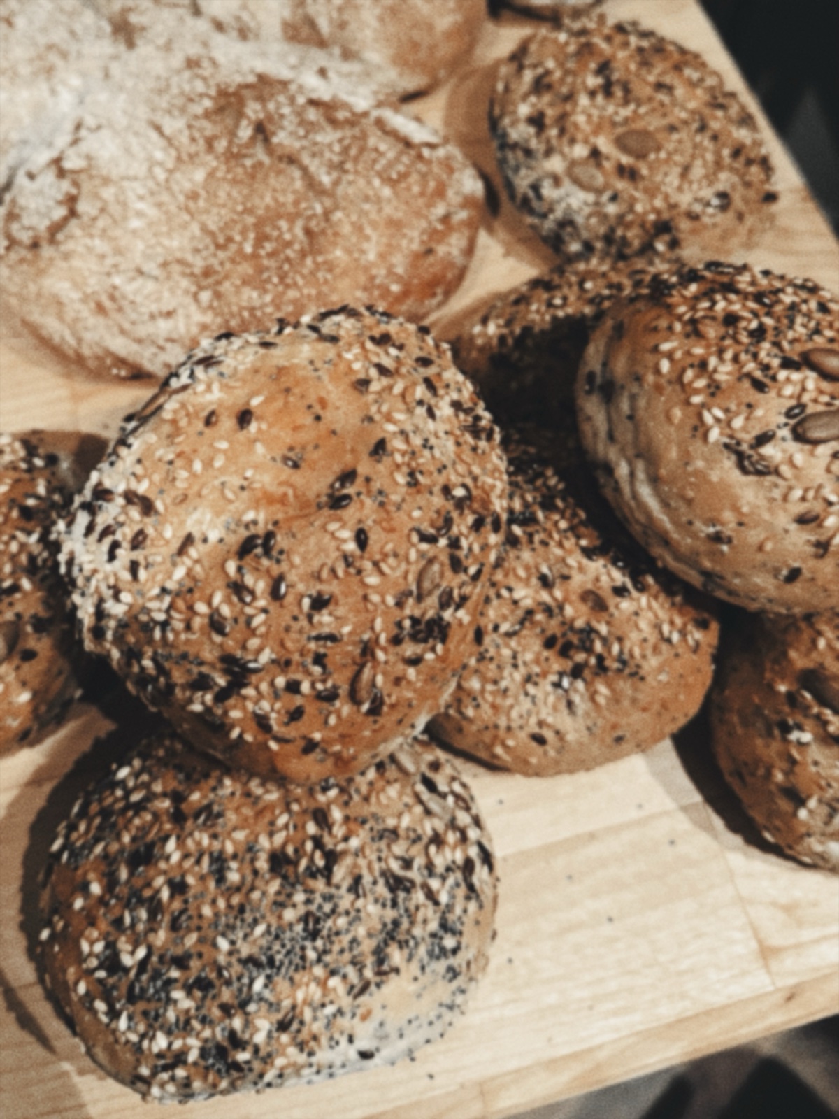 A closer view of the seeded rolls and rustic loaves