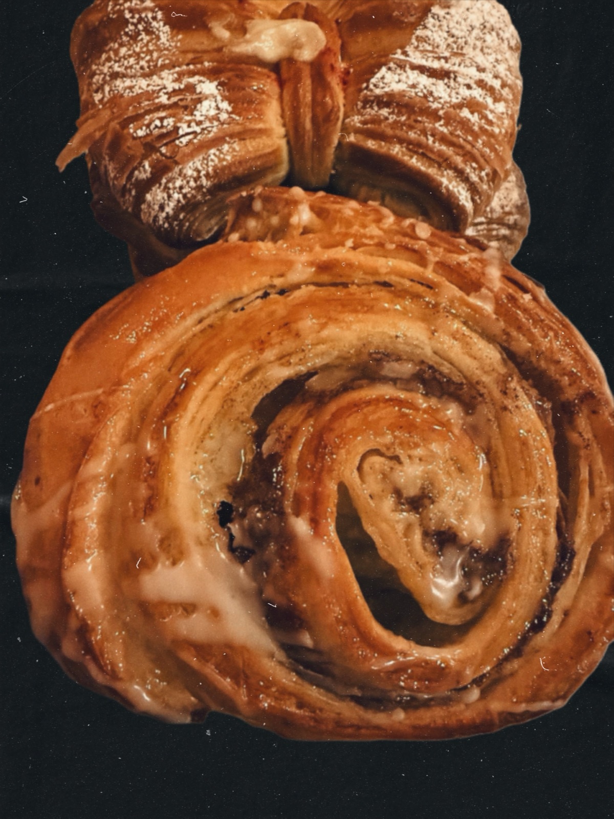 Glazed cinnamon swirl Danish pastry